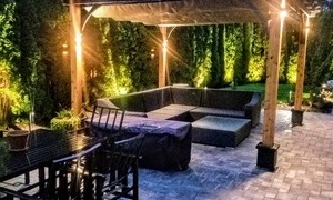 arbor with lighting and patio lounge